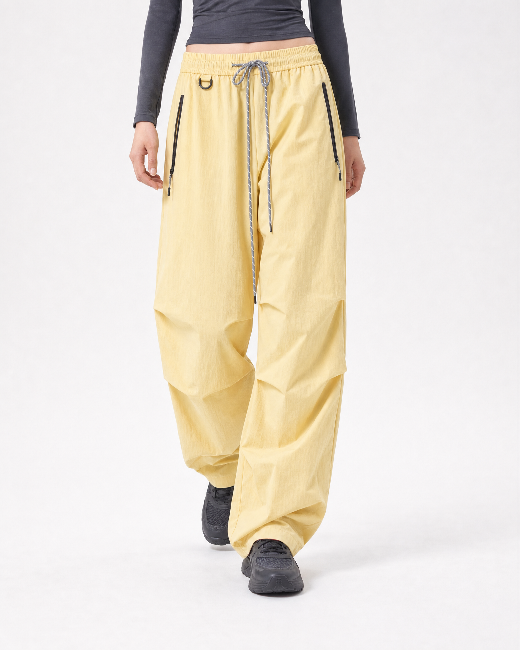Women's water-repellent hiking trousers in yellow, straight on mid stride # Colour_Yellow
