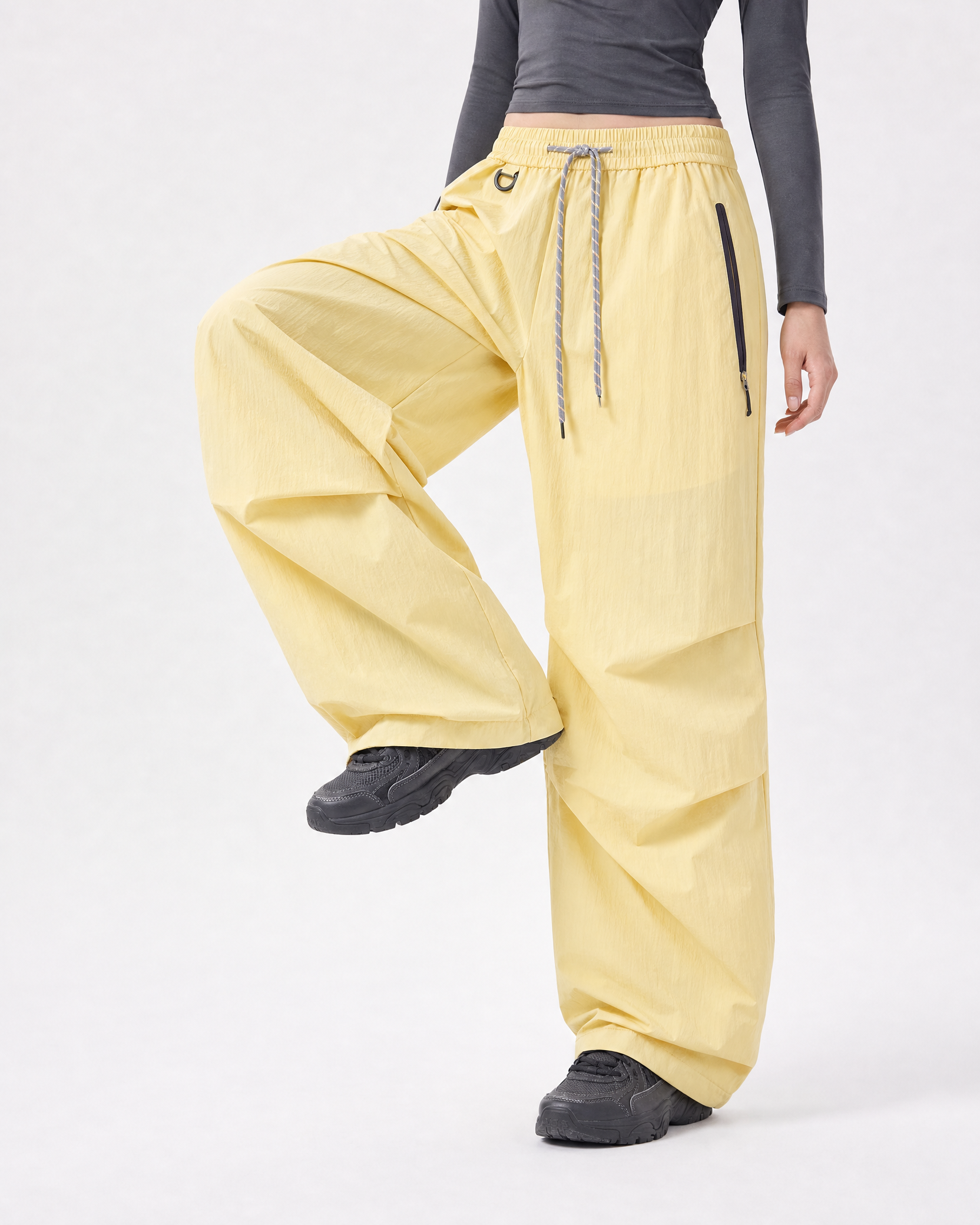 Women's water-repellent hiking trousers in yellow, leg lift motion # Colour_Yellow
