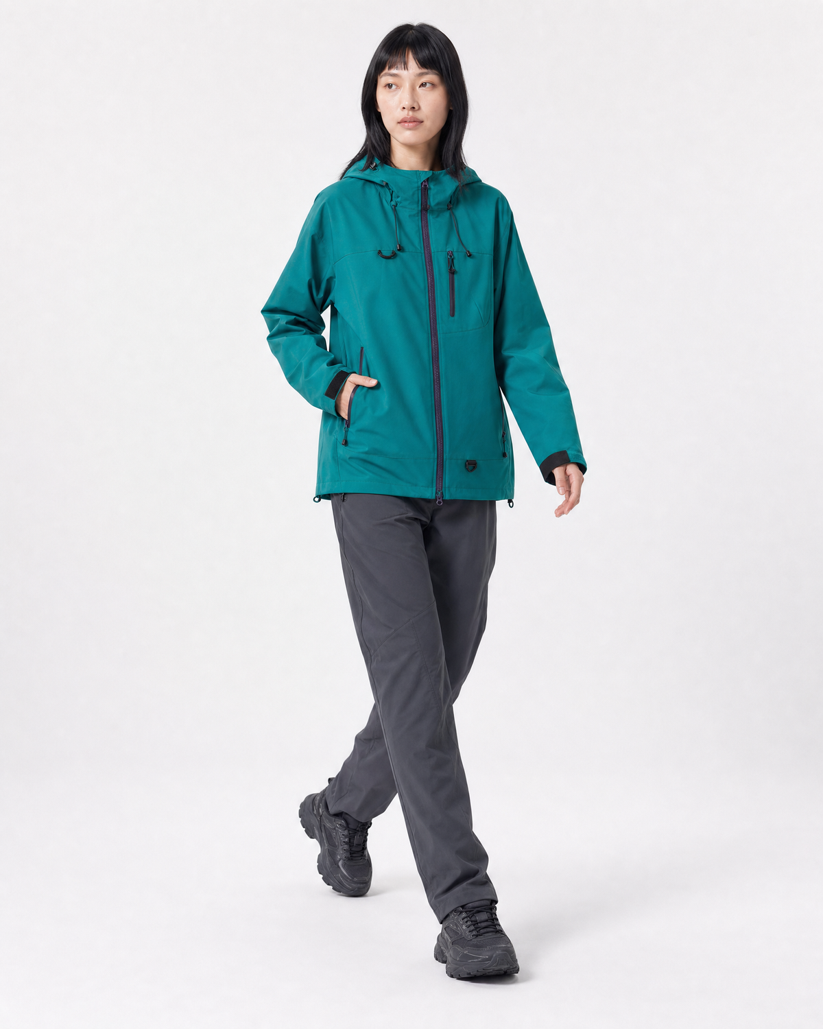 Pact Unisex Water-Repellent Hooded Windbreaker in Dark Green, three-quarter walking # Colour_Dark Green