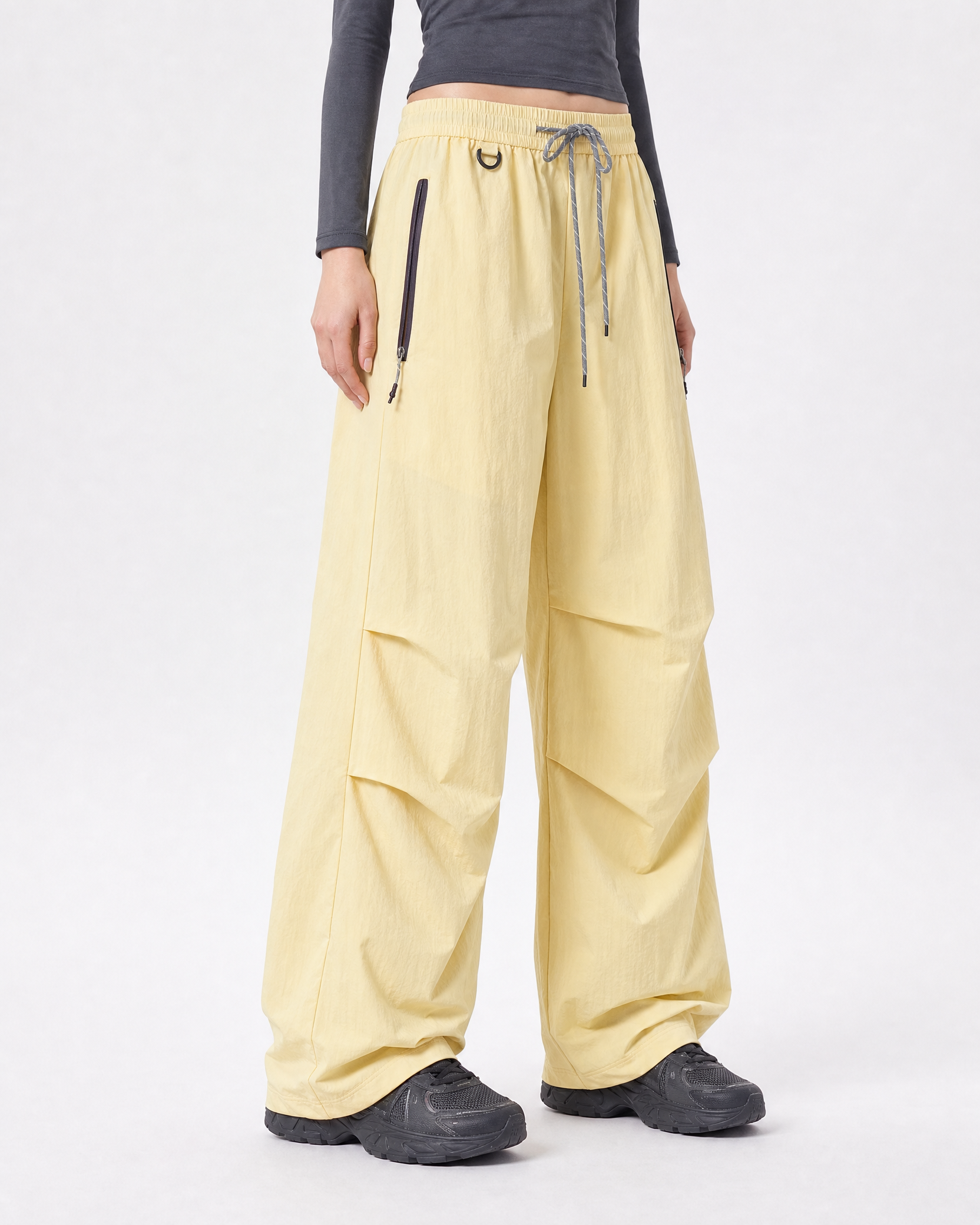 Women's water-repellent hiking trousers in yellow, three-quarter side drape # Colour_Yellow