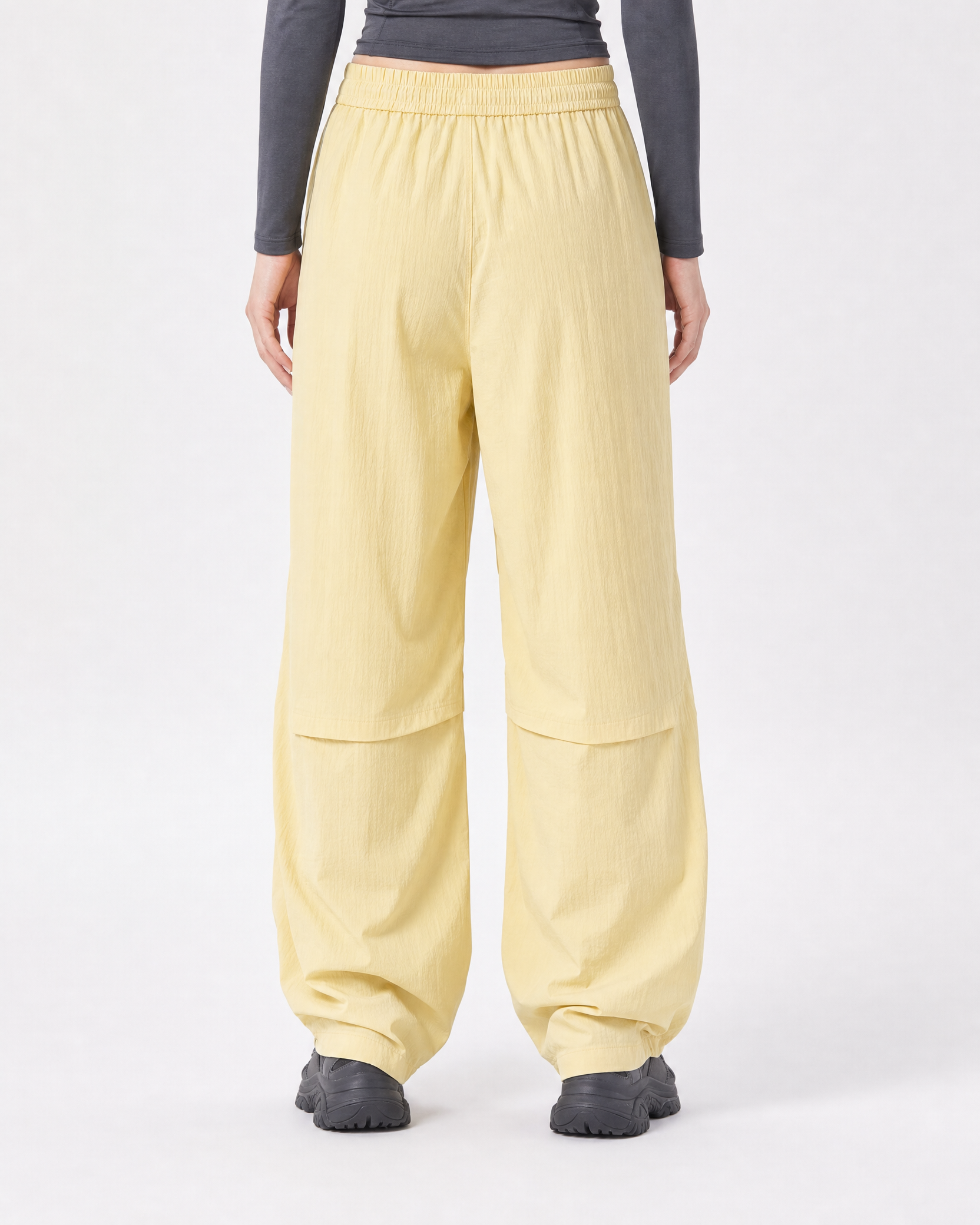 Women's water-repellent hiking trousers in yellow, back view # Colour_Yellow
