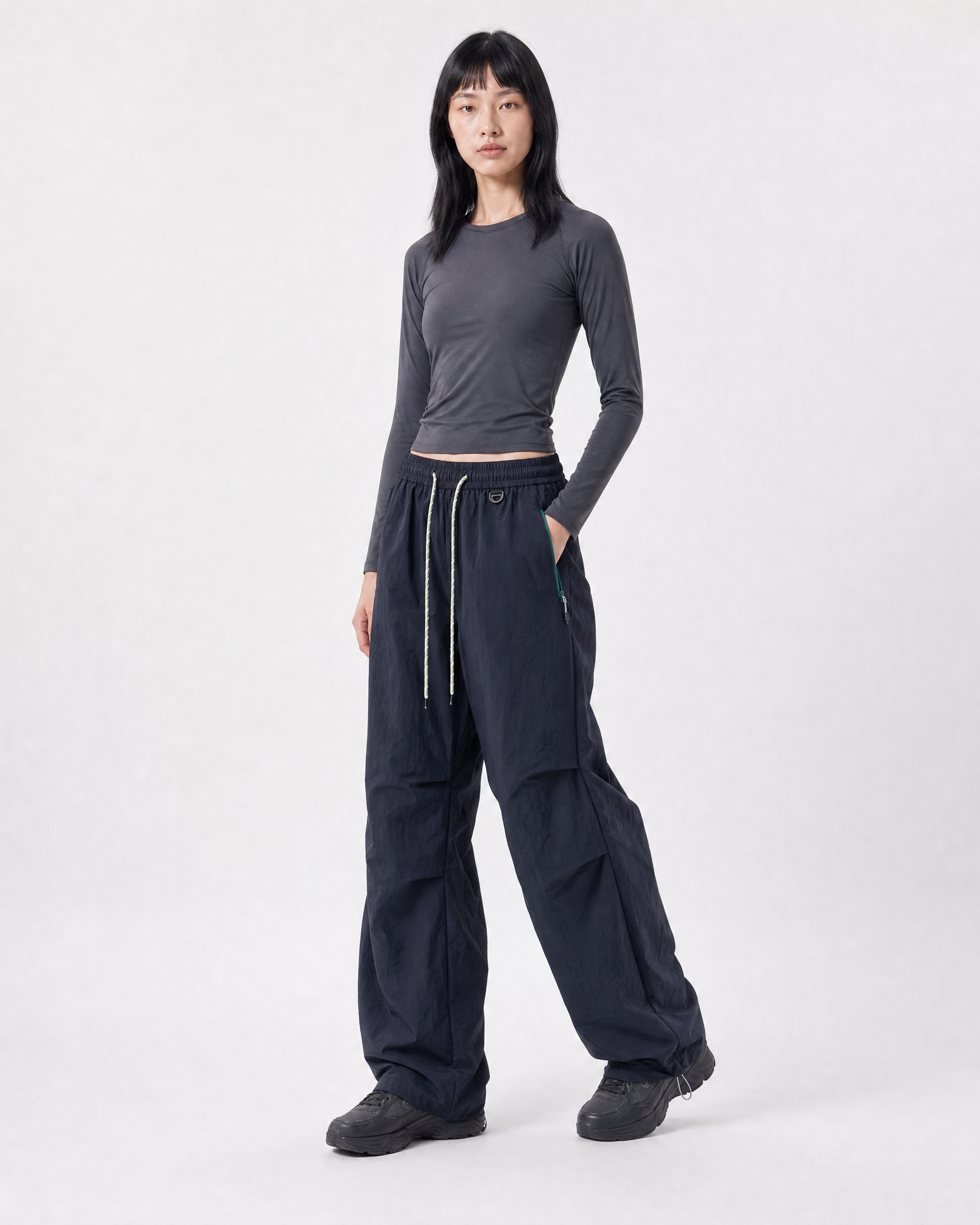 Women's water-repellent hiking trousers in navy, three-quarter portrait # Colour_Navy