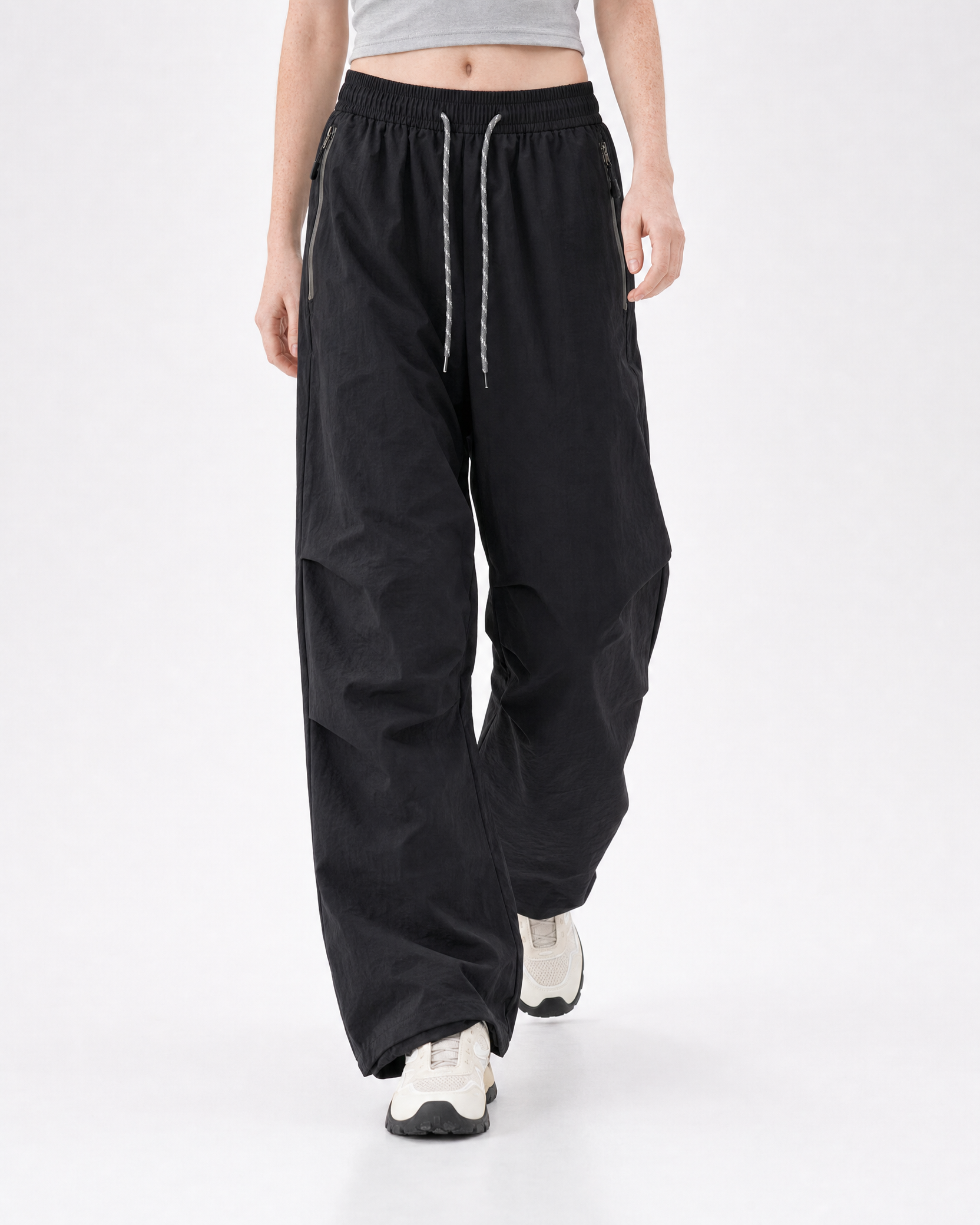 Women's water-repellent hiking trousers in black, front stride # Colour_Black