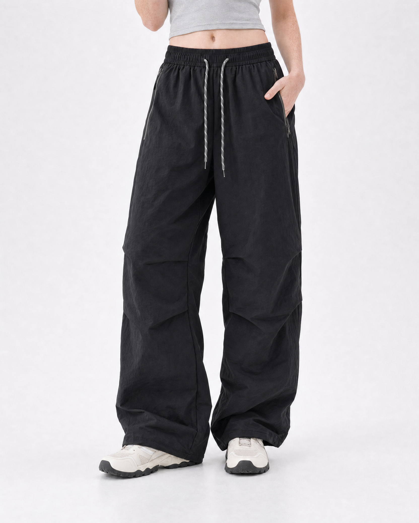 Women's water-repellent hiking trousers in black, relaxed stance # Colour_Black